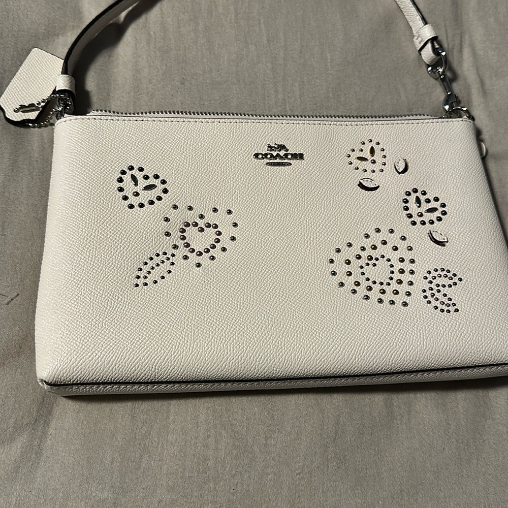 Coach White Clutch with Structured Design and Metal Accents